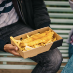Fish and chips in a takeaway box