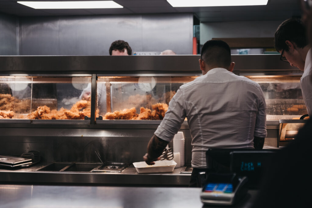 Wells-next-the-sea,,Uk,-,April,20,,2019:,Staff,Serving,Fish,And